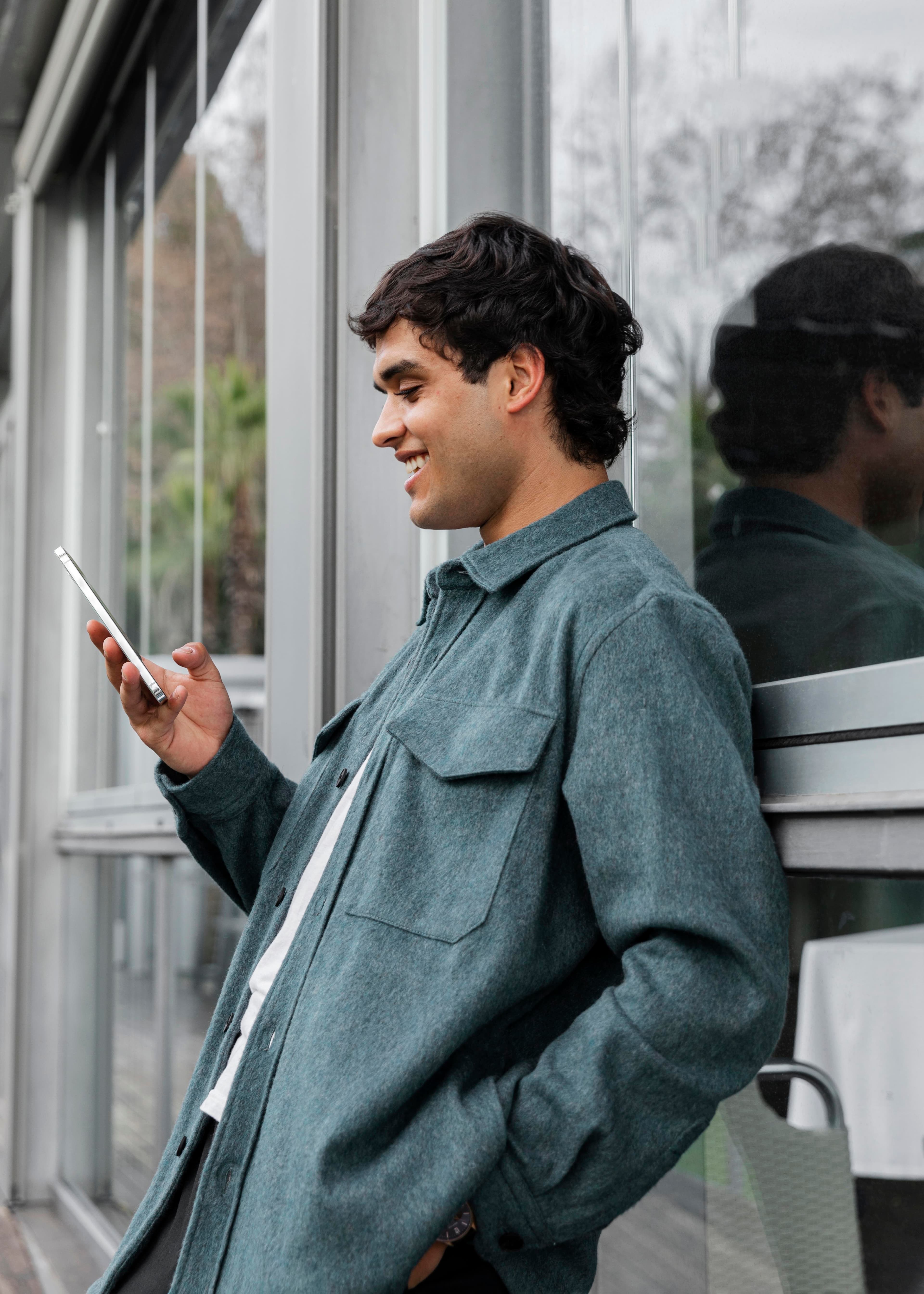 Smiling professional using a smartphone